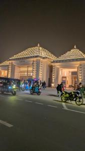 a group of motorcycles parked in front of a building at Ashirbad hotel in Digha
