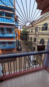 a view of a building from a balcony at Ashirbad hotel in Digha