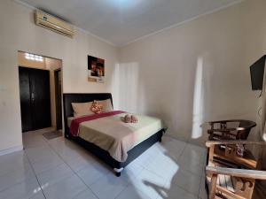 Ένα ή περισσότερα κρεβάτια σε δωμάτιο στο Saphala Suites Secondfloor