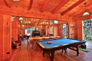 a billiard room with a pool table in a house at Bruny Island Lodge in South Bruny