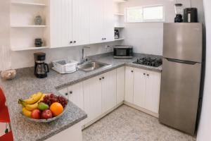 Køkken eller tekøkken på Harmonia - Sunbeha resort, Juan Dolio + 9 billeder