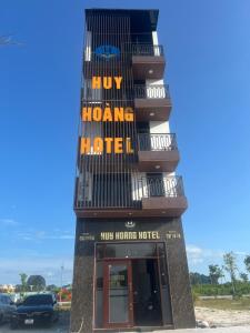 a building with a sign that reads my home hotel at Huy hoang hotel 