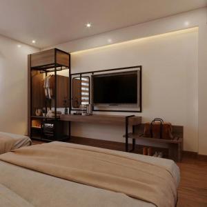 a room with two beds and a flat screen tv at Huy hoang hotel 