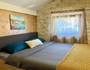 Giường trong phòng chung tại Apartments Obradovic