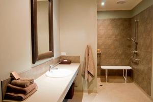 a bathroom with a sink and a shower at Bairnsdale Motel in Bairnsdale +18 photos