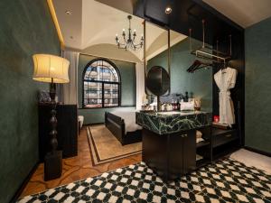 a bathroom with a sink and a bed in a room at 龄舍1927酒店 in Wuhan