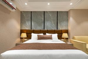 Postel nebo postele na pokoji v ubytování Hotel Vivanta Residency Delhi Airport + 122 fotografií