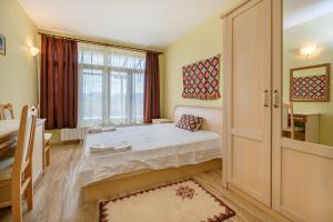a small bedroom with a bed and a window at Guesthouse Gostilitsa in Gostilitsa +69 photos