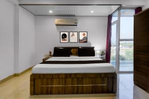 Postel nebo postele na pokoji v ubytování Collection O Ak Hotels + 56 fotografií