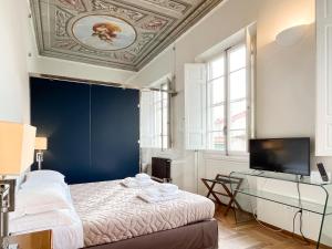 Телевизор и/или развлекательный центр в Hotel la Scala