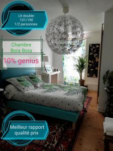 a poster of a bedroom with a bed and a chandelier at Clos Germanois in Saint-Germain-Laval