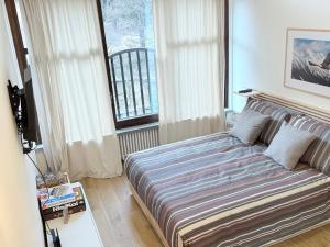 En eller flere senge i et værelse på Appartamento Weissmatten