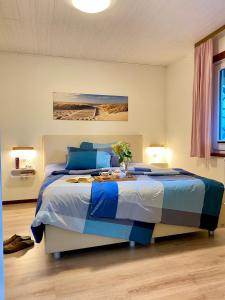 En eller flere senge i et værelse på Ferienhäuser Pannier III und IV Doppelhaushälften + 59 billeder