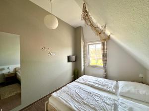 Postel nebo postele na pokoji v ubytování Fischer's Ferienhaus Rügen mit Sauna und Kamin