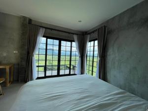 Ένα ή περισσότερα κρεβάτια σε δωμάτιο στο Por Sampao Camp&Resort