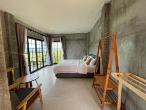 Ένα ή περισσότερα κρεβάτια σε δωμάτιο στο Por Sampao Camp&Resort