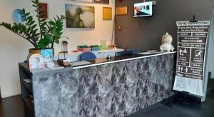 a counter in a restaurant with a counter top at Cappuccino Hotel @ Mount Austin in Johor Bahru