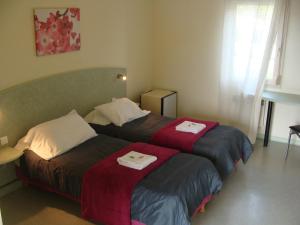 Postel nebo postele na pokoji v ubytování Abel Hôtel