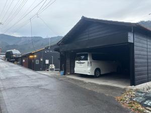 a white van is parked in a garage at Tokurajyo - Vacation STAY 15813 in Akiruno +18 photos