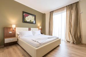 Postel nebo postele na pokoji v ubytování KEIT Hotel