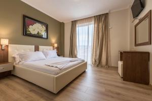 Postel nebo postele na pokoji v ubytování KEIT Hotel