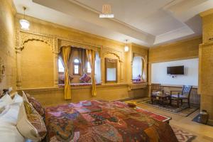 a bedroom with a large bed in a room at Hotel Rugh Niwas in Jaisalmer