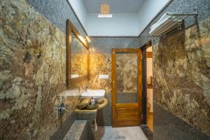 a bathroom with a sink and a mirror at Hotel Rugh Niwas in Jaisalmer +54 photos