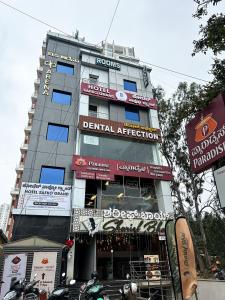 a building with signs on the side of it at Hotel SAFKO Grand - Hopefarm Metro Whitefield in Bangalore