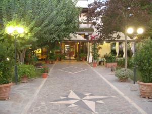 a walkway with a star on it in front of a building at Hotel da Rosanna in Attigliano