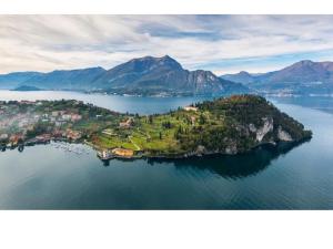 an island in the middle of a large body of water at Pescallo Apartments in Bellagio