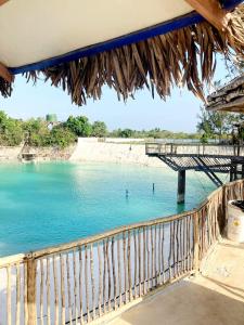 a view of a body of water with a bridge at Brisa & Mar do Preá-700 m da praia e 12 km de Jeri in Jericoacoara