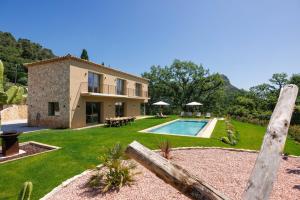 an external view of a house with a swimming pool at Villa Maynaya in Vence