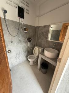 a bathroom with a toilet and a sink at Three Monkeys Mae Nam beach in Amphoe Koh Samui +26 photos