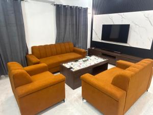 Μια τηλεόραση ή/και κέντρο ψυχαγωγίας στο Appartement de 2 chambre et un salon