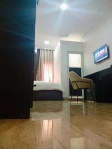 TV a/nebo společenská místnost v ubytování Heirloom Luxury Hotel and Apartments