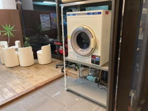 a washer and dryer in a room at LEGALCOURT - Vacation STAY 14717 in Akiruno