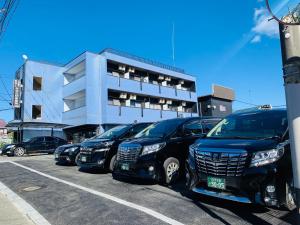 a row of parked cars parked in a parking lot at LEGALCOURT - Vacation STAY 14717 in Akiruno