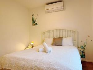 En eller flere senge i et værelse på Home of Ringwood - Wilana