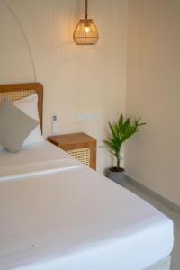 En eller flere senge i et værelse på Samudra Ahangama