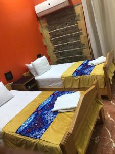 En eller flere senge i et værelse på New Golden Cairo Down Town