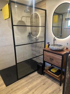 a bathroom with a sink and a mirror at JustB in Riemst +14 photos