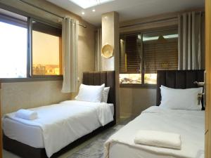 Postel nebo postele na pokoji v ubytování Shams House