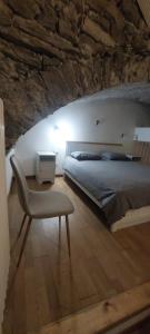 En eller flere senge i et værelse på Casa Vacanza OXILIA