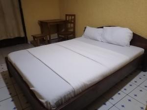 En eller flere senge i et værelse på Viva Lodge