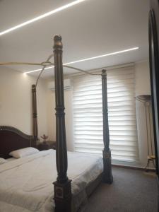 En eller flere senge i et værelse på Power Stay Hotel