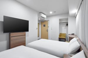 TV a/nebo společenská místnost v ubytování Sotetsu Fresa Inn Kitahama + 50 fotografií