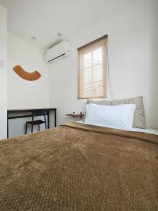 Postel nebo postele na pokoji v ubytování The Ubuntu House + 36 fotografií