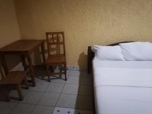 Giường trong phòng chung tại Viva Lodge