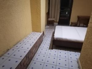 Giường trong phòng chung tại Viva Lodge