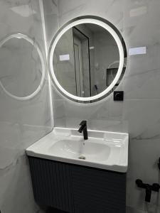 a bathroom with a sink and a mirror at Shahdag Mountain Breeze in Qusar +42 photos